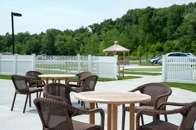 Outdoor seating area with gazebo and greenery