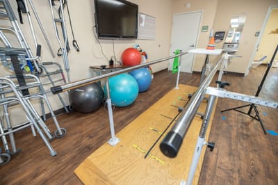 Rehabilitation space with exercise equipment and therapy bars