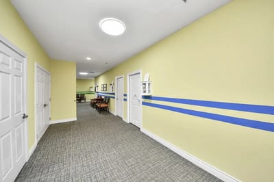Brightly lit hallway in a memory care facility