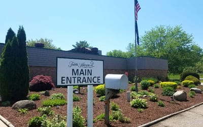 Exterior view of facility main entrance with landscaping