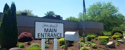 Main entrance sign of Faith Haven Senior Care Center.