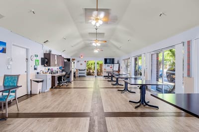 Interior view of a common area with dining tables