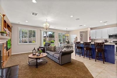 A cozy common area with seating and dining space