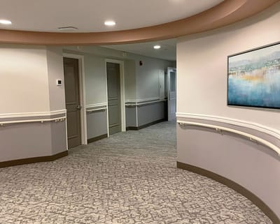 A well-lit interior corridor of the facility