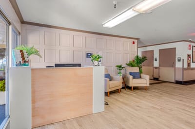 Reception area with seating and plants in a nursing home