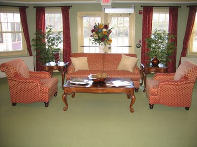 Cozy common area with a sofa and armchairs