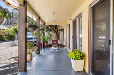 Outdoor patio area with plants and seating