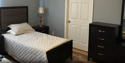 Cozy resident room with a bed and furniture