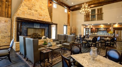 Interior common area with seating and a fireplace