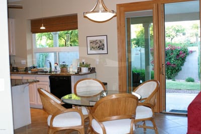 Bright dining area with a view of the garden
