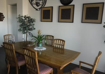 Interior view of a dining area with a wooden table and chairs