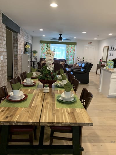 Dining area with a large table set for a meal