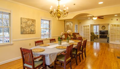 Interior dining area with a large table and decor