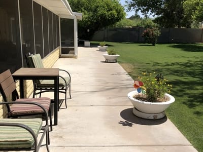 Outdoor patio area with seating and plants