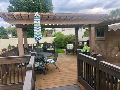 Outdoor patio area with seating and a pergola