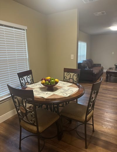 Bright dining area with fruits on the table
