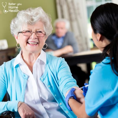 A caregiver taking a resident's blood pressure