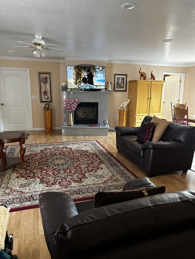 Comfortable common area with seating and a TV