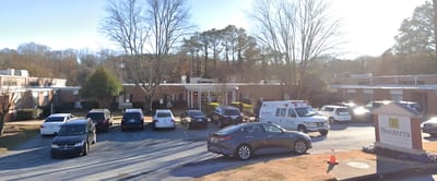 Bonterra Transitional Care and Rehabilitation, Nursing Home in Atlanta, GA — Exterior view of Bonterra facility with vehicles