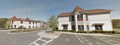 Exterior view of Braemar at Medford with residents outside