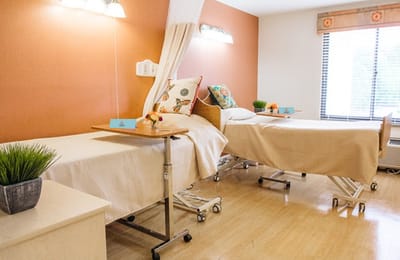 Bright and inviting resident room with two beds
