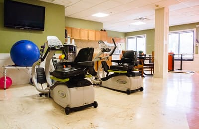 Fitness equipment in a bright exercise room