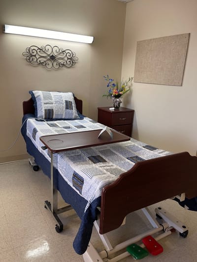 A cozy resident room with a bed and decoration