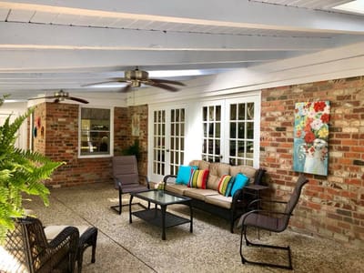 Covered seating area with colorful cushions