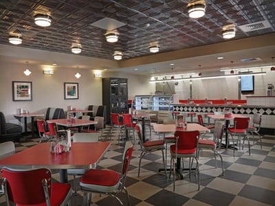 Bright dining area with red and black decor