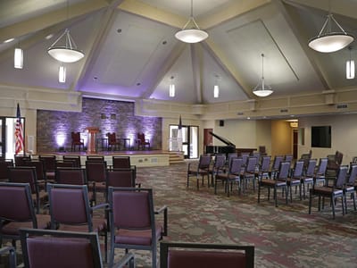 Interior of a spacious multi-use room with seating