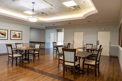 Bright common area with tables and chairs for gatherings