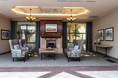 Cozy lobby area with comfortable seating and windows