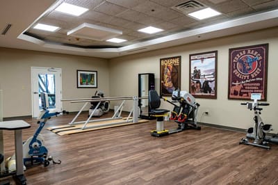 Physical therapy room with exercise equipment