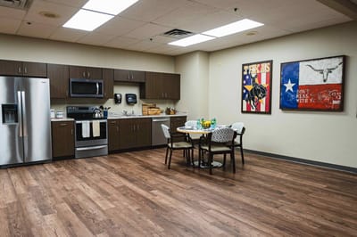 Interior view of a communal kitchen area in a nursing facility