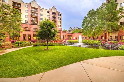 Beautiful landscaped courtyard with a fountain and seating