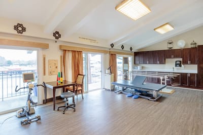 Therapy room with exercise equipment and large windows