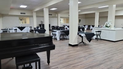 Interior dining area with tables and piano