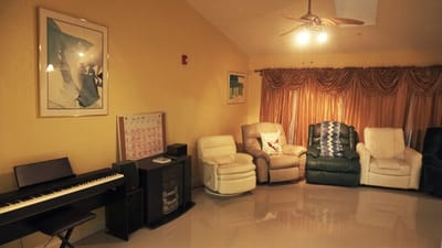Cozy common area with seating and a piano