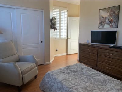 Cozy resident room with a chair and TV
