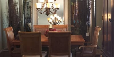 Dining room with wooden table and chandelier