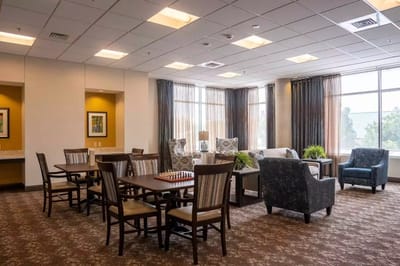 Bright common area with seating and dining tables