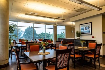 Bright dining room with tables and chairs