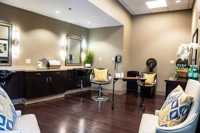 Bright spa area with seating and mirrors
