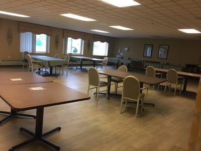 Interior view of a common area with tables and chairs