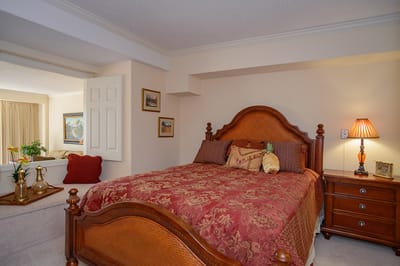 Cozy bedroom with a decorative bed and lamps