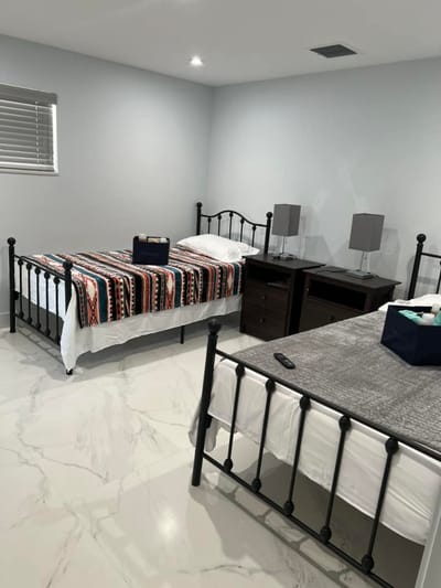 Shared resident room with two beds and bedside tables