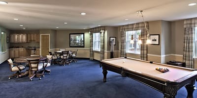 Interior common area with a pool table and seating