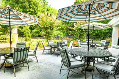 Outdoor patio area with tables and umbrellas