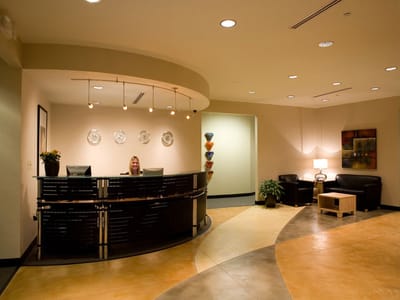 Reception area with staff member at the front desk