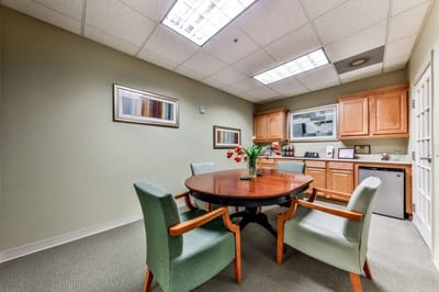 Interior of a communal living space with a dining table